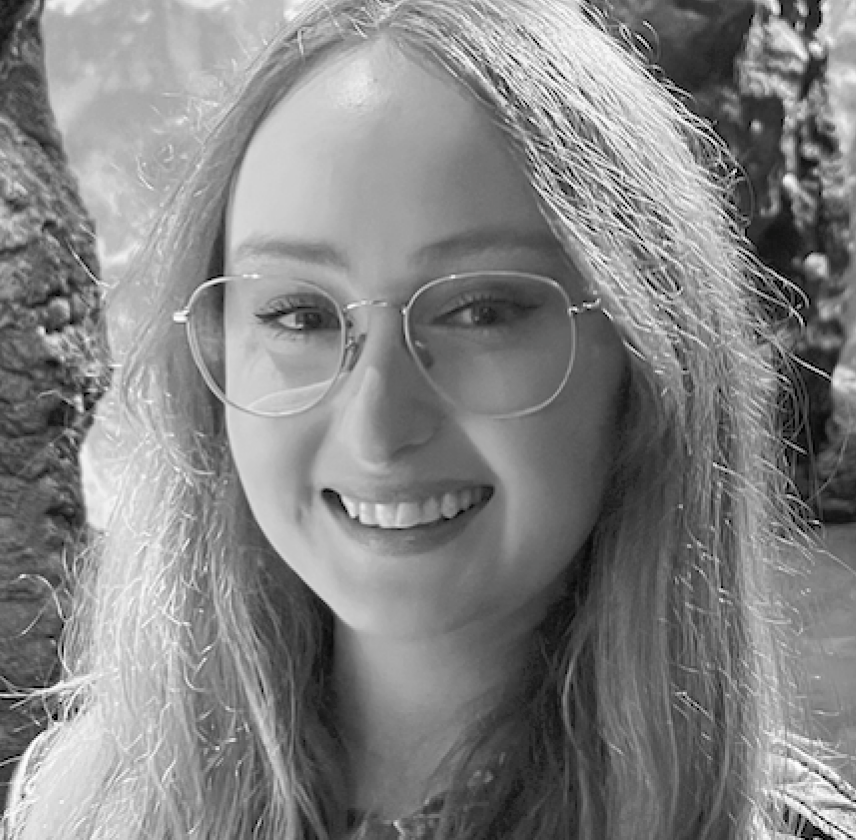 Black and white image of Chantelle smiling at the camera